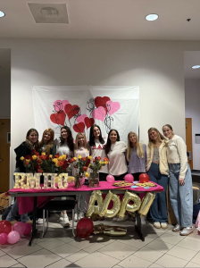 Alpha Delta Pi members pose with their display for the Roses for RMHC event in the Plemmons Student Union on Feb. 12. Courtesy of Virginia Plettner.